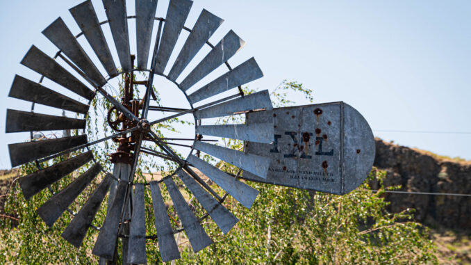 Cover Photo A windmill is idle in Washtucna, Washington.