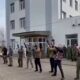 Russian militants stand outside a hotel turned into barracks in Kadiivka, Luhansk, before it was destroyed in a HIMARS attack
