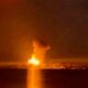 A fireball lights up the night sky on the Antonovsky Bridge in Kherson after a rocket fired by HIMARS hits the structure