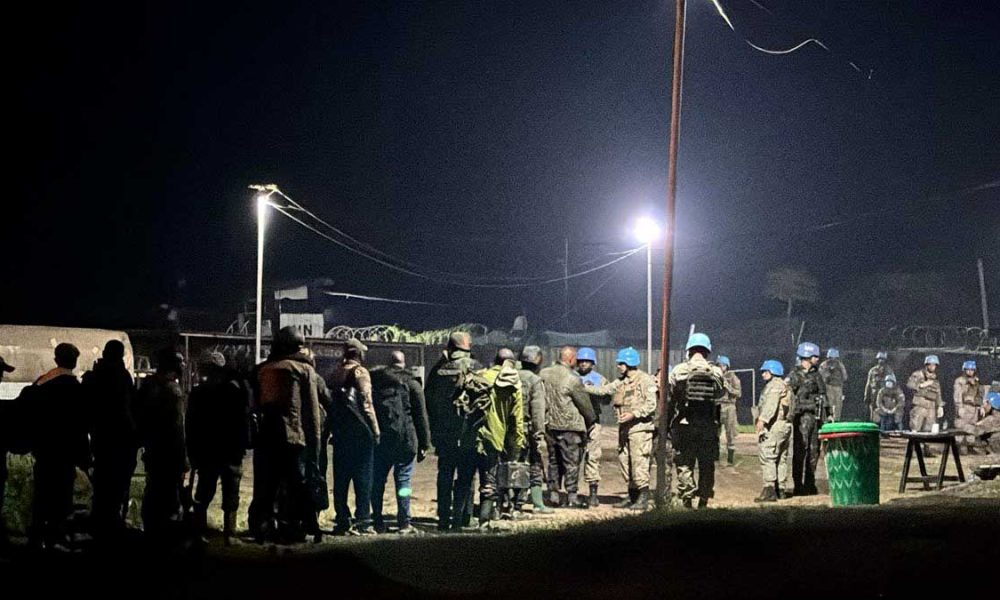 Congolese Army Soldiers in line to turn their weapons into U.N. peacekeepers in the Goma, Democratic Republic of Congo.