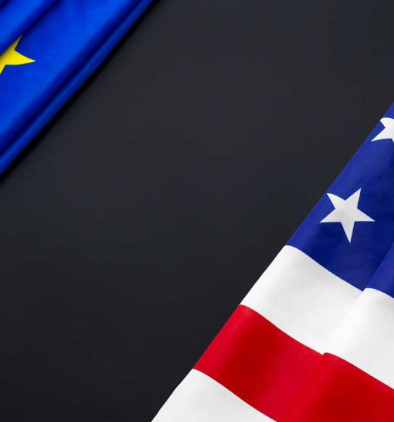 european union and united states flag with a large black area between