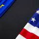 european union and united states flag with a large black area between