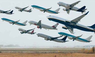A picture of multiple airplanes leaving an airport