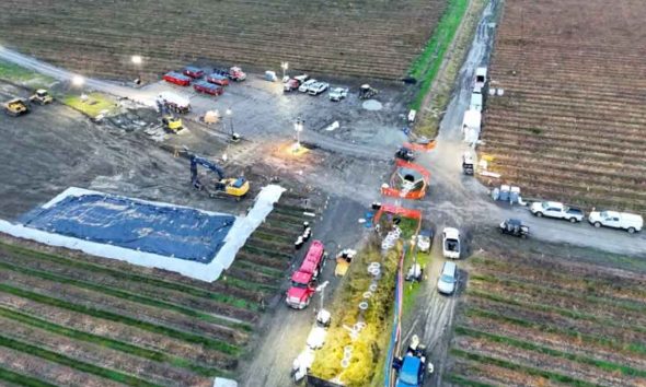 Drone view of BP repairing Olympic Pipeline in a Washington state blueberry field